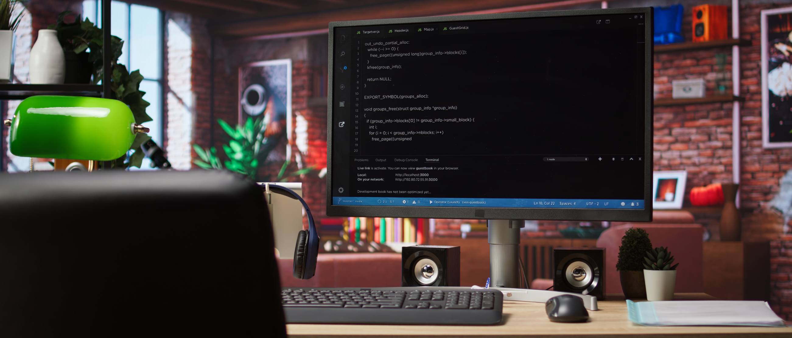 Web development coding on laptop with modern workspace