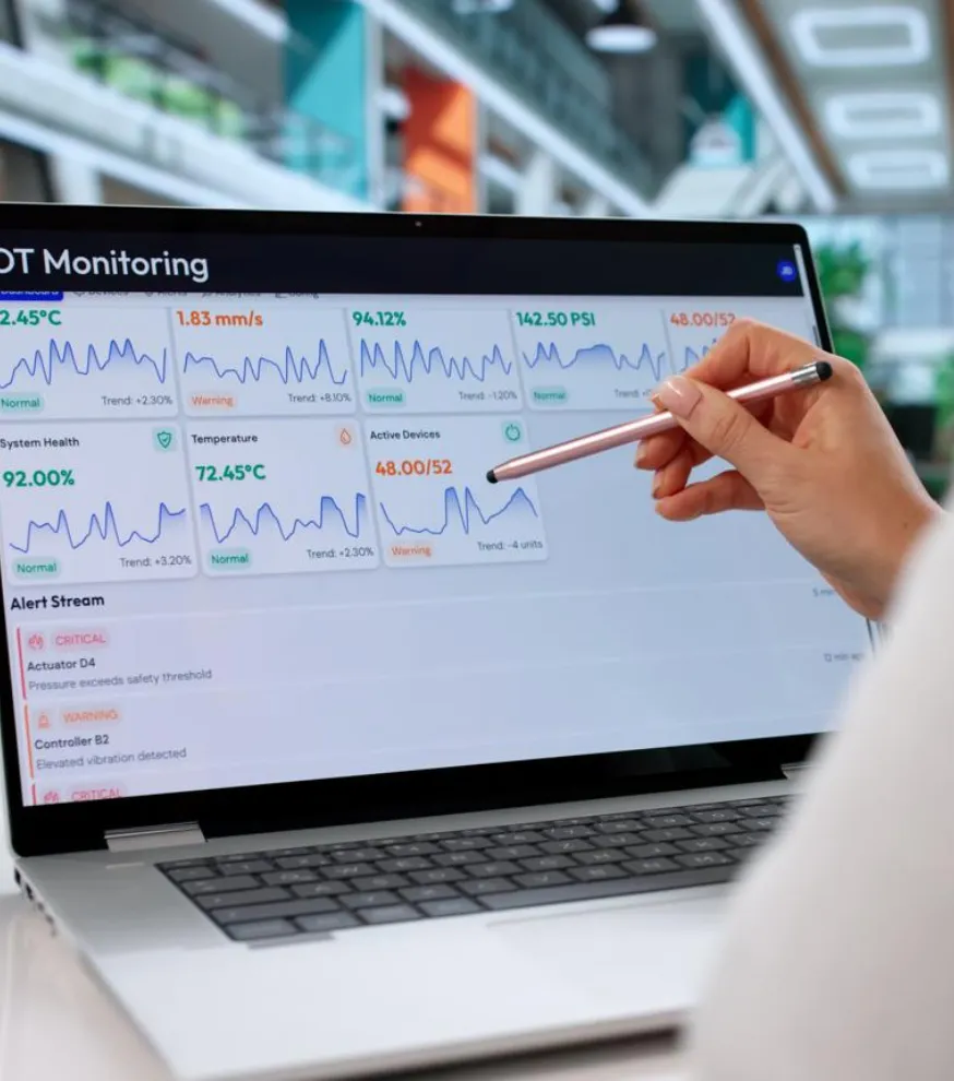 IoT developer monitoring connected devices and real-time analytics dashboard