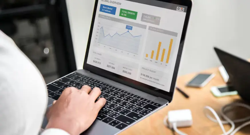 Digital advertising campaign analytics and performance metrics on a laptop